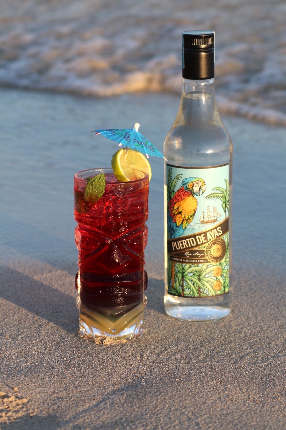 Puerto Sunrise Cocktail am Strand