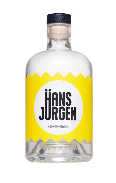 Flasche Hans-Jürgen Gin "Heißzeit" mit markantem gelbem Etikett, schwarzer Schrift und modernem London Dry Gin-Design.