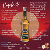 Sanz Haselnuss-Sirup mit Infos zu Herkunft, Aromenprofil, Verwendung in Cocktails, Kaffee und Smoothies vor rotem Hintergrund.