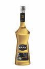 Holunderblütensirup Sanz 0,7L in eleganter Glasflasche mit schwarzem Etikett und goldgelbem Sirup.