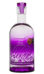 Tann’s Premium Gin in transparenter Flasche mit violettem Design, silberner Verzierung und violettem Verschluss.