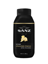 Weiße Schokolade Sirup Sanz in einer schwarzen 650-ml-Flasche mit Abbildung von Schokoladenraspeln auf dem Etikett.
