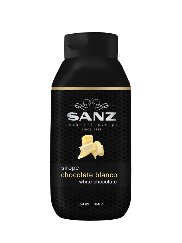 Weiße Schokolade Sirup Sanz in einer schwarzen 650-ml-Flasche mit Abbildung von Schokoladenraspeln auf dem Etikett.
